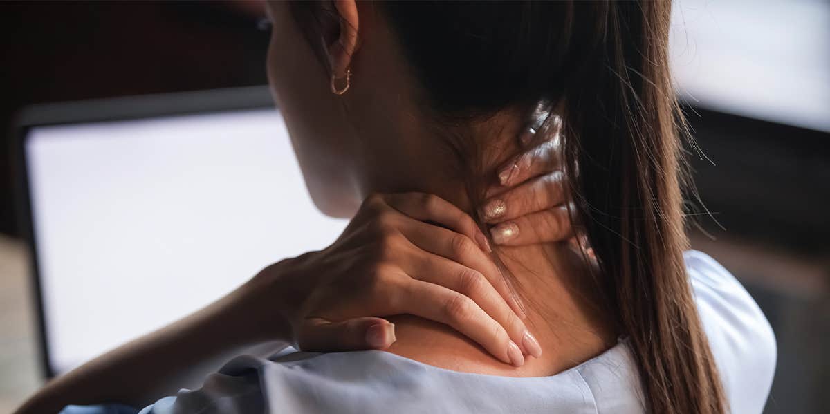 14 Super-Simple Ways To Relieve Stress In 5 Minutes Or Less woman having neck pain while working