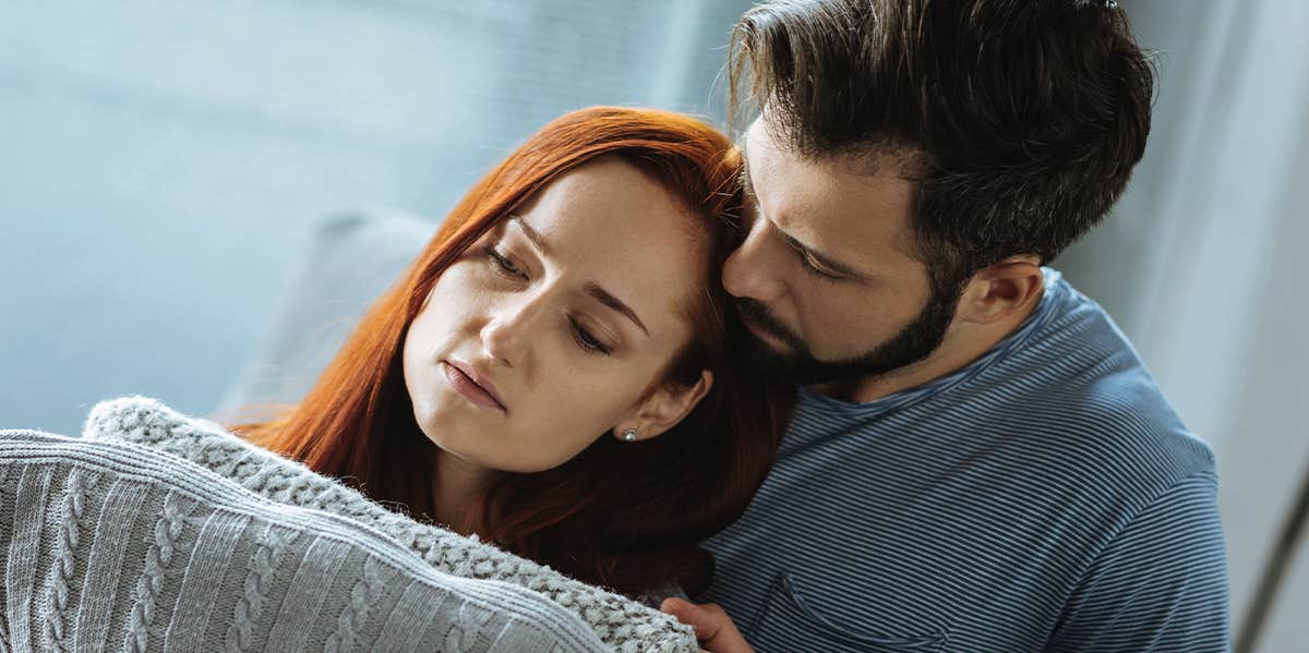 Innocent words that drive couples apart man cuddling woman