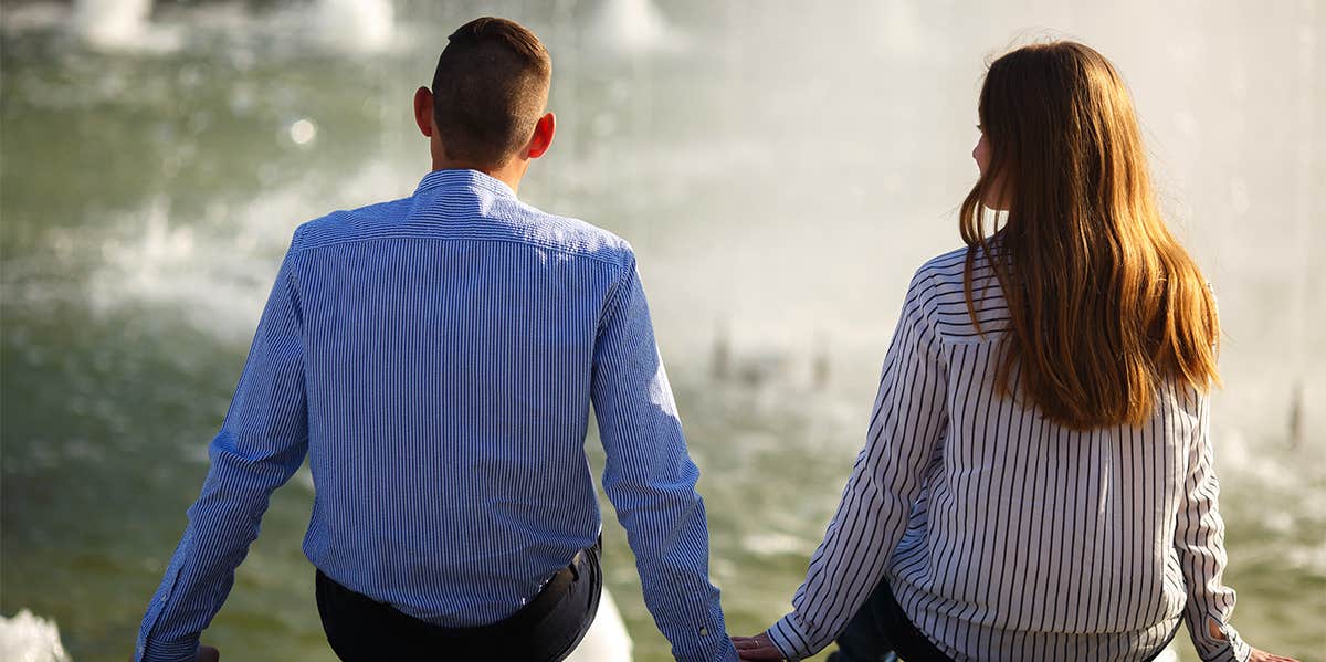 man and woman sitting together