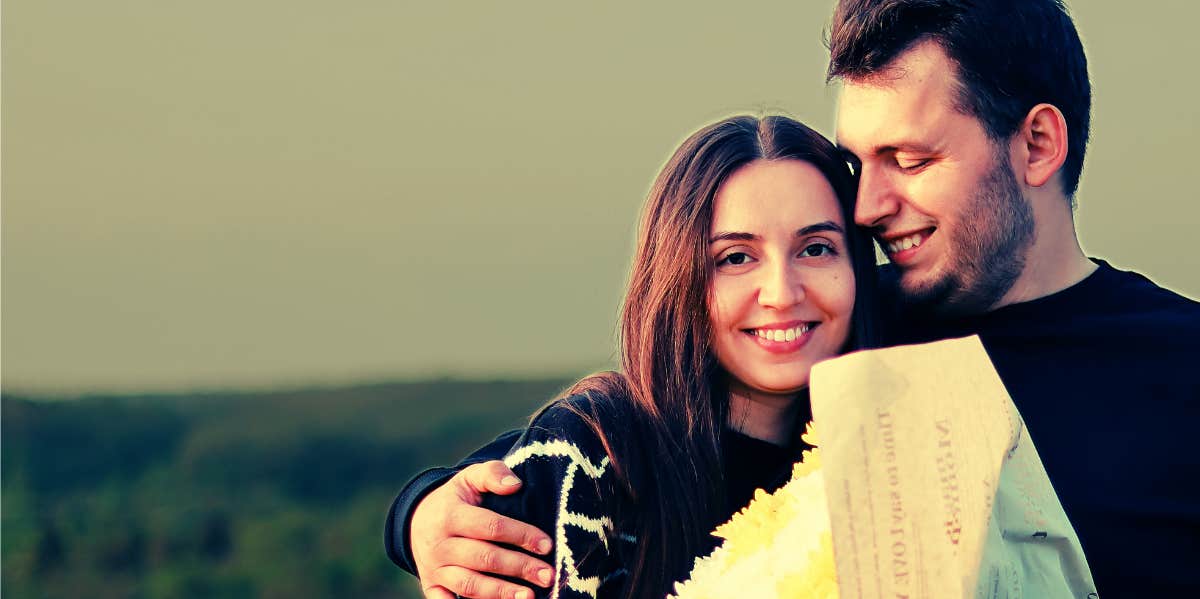 couple holding flowers 