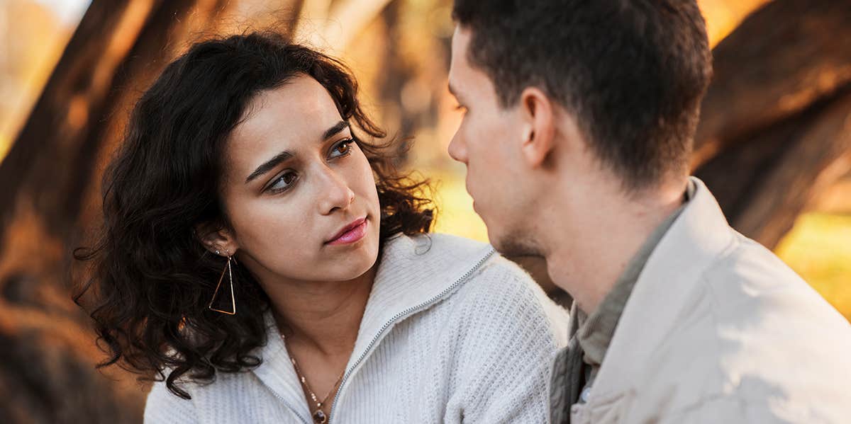 man and woman talking