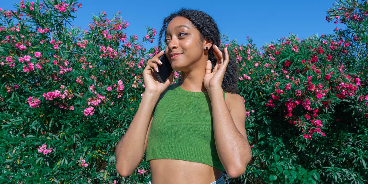 woman on phone in garden