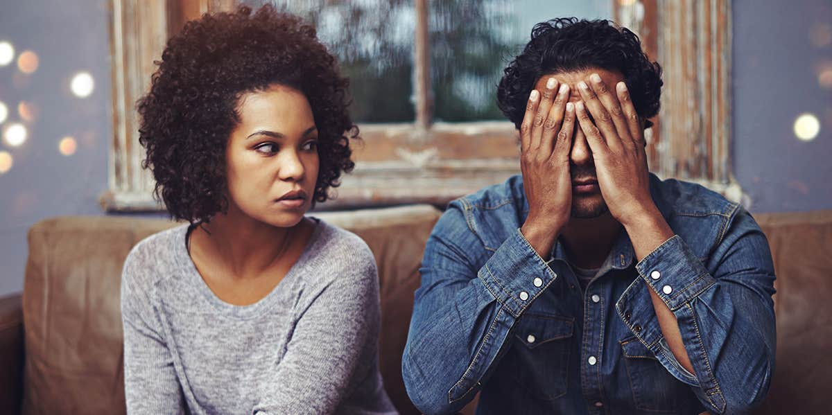 unhappy couple sitting together