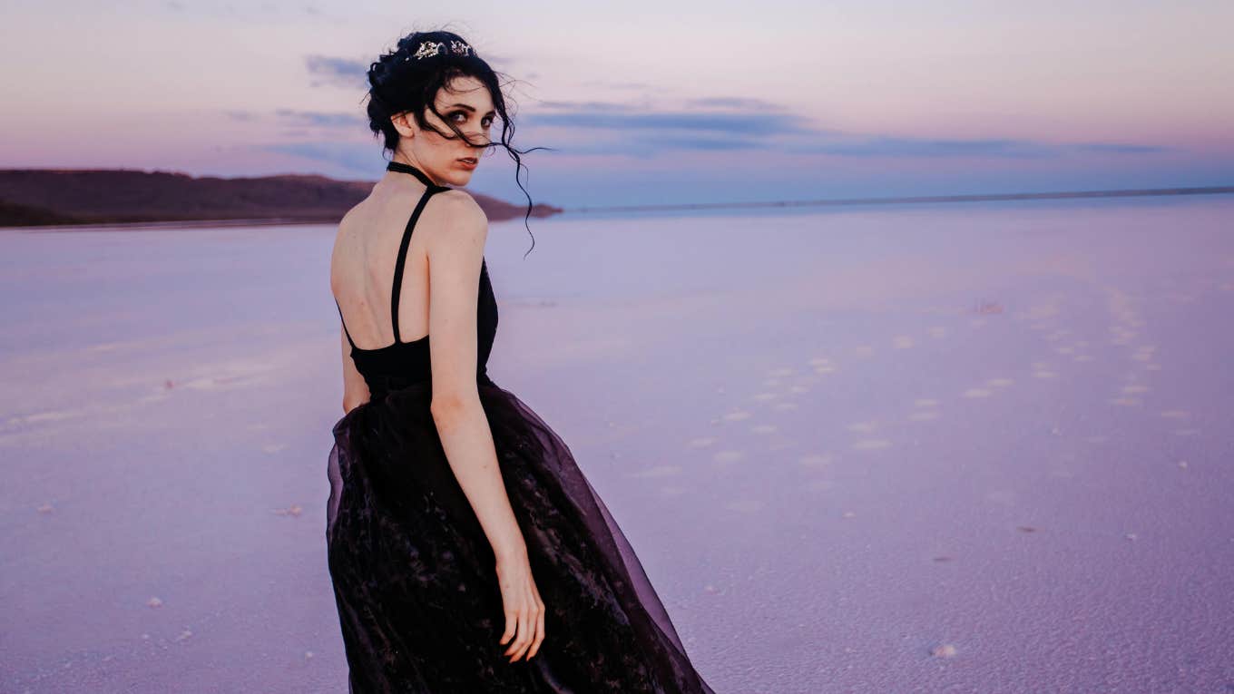 woman standing by ocean 