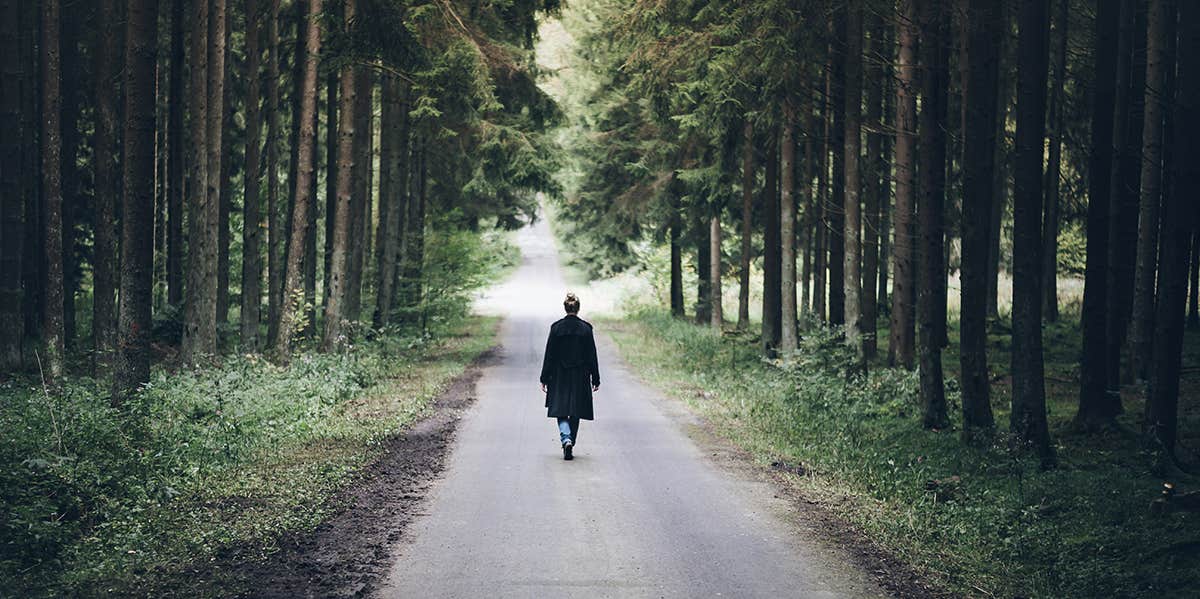 4 Subtle Signs You’re Going the Wrong Way in Life woman walking down path