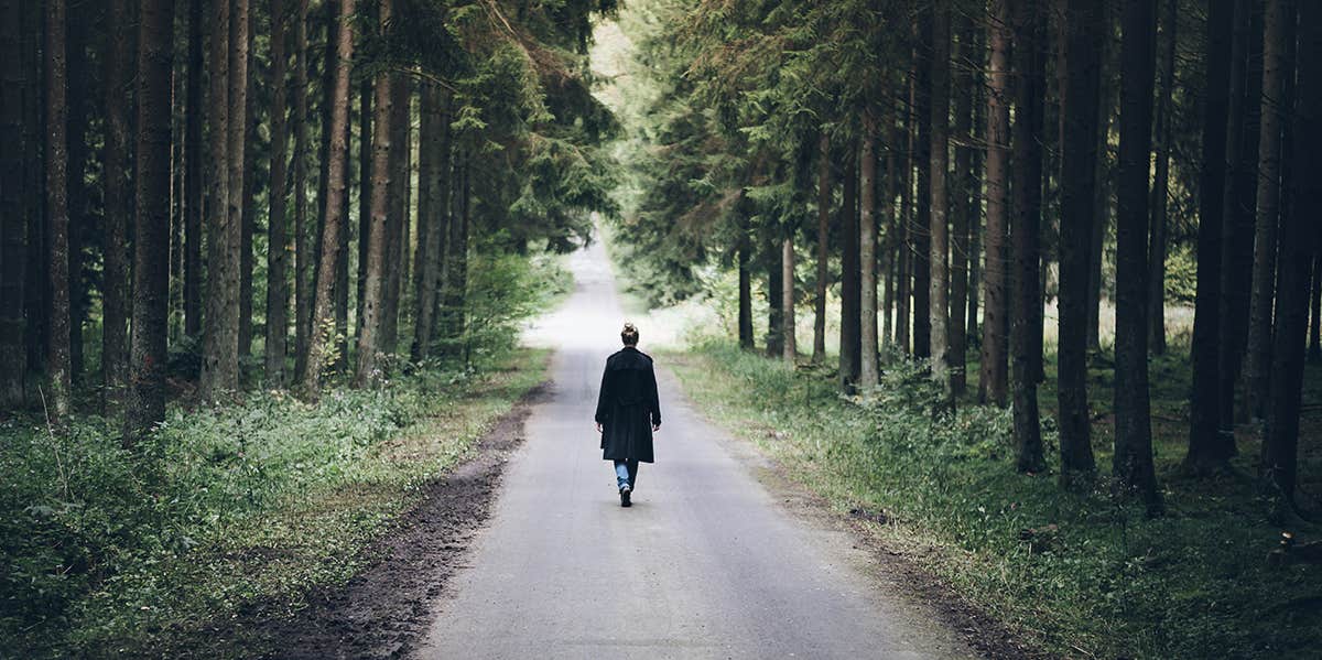 woman walking down path