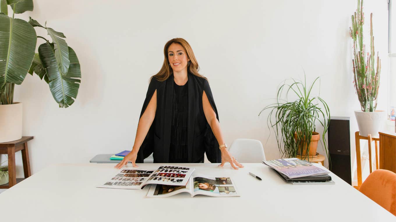 woman standing at conference table 