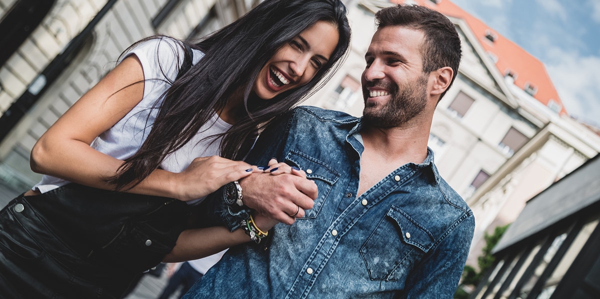 man and woman laughing