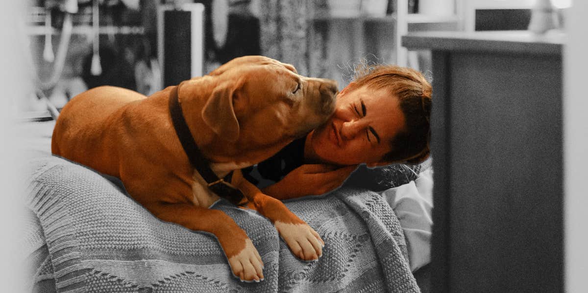 woman on bed with dog