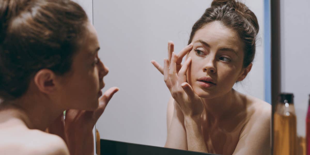 5 Bad Habits That Reveal A Lot About Your Hygiene woman in mirror