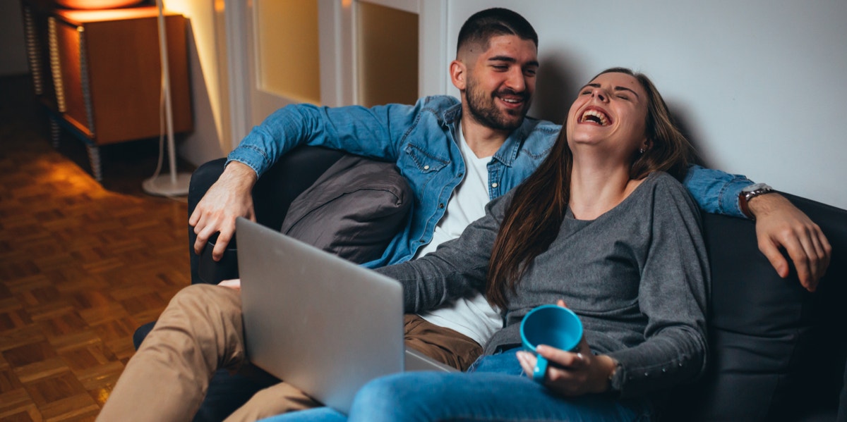 man and woman laughing