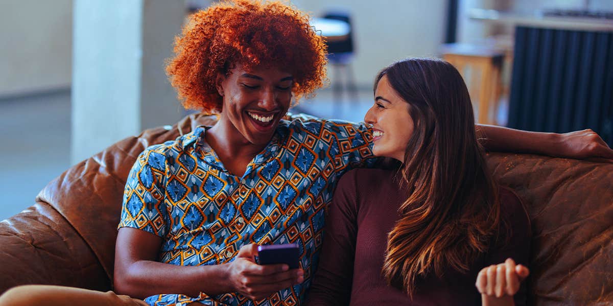 5 Phrases That Erode A Man's Confidence couple talking on the couch laughing