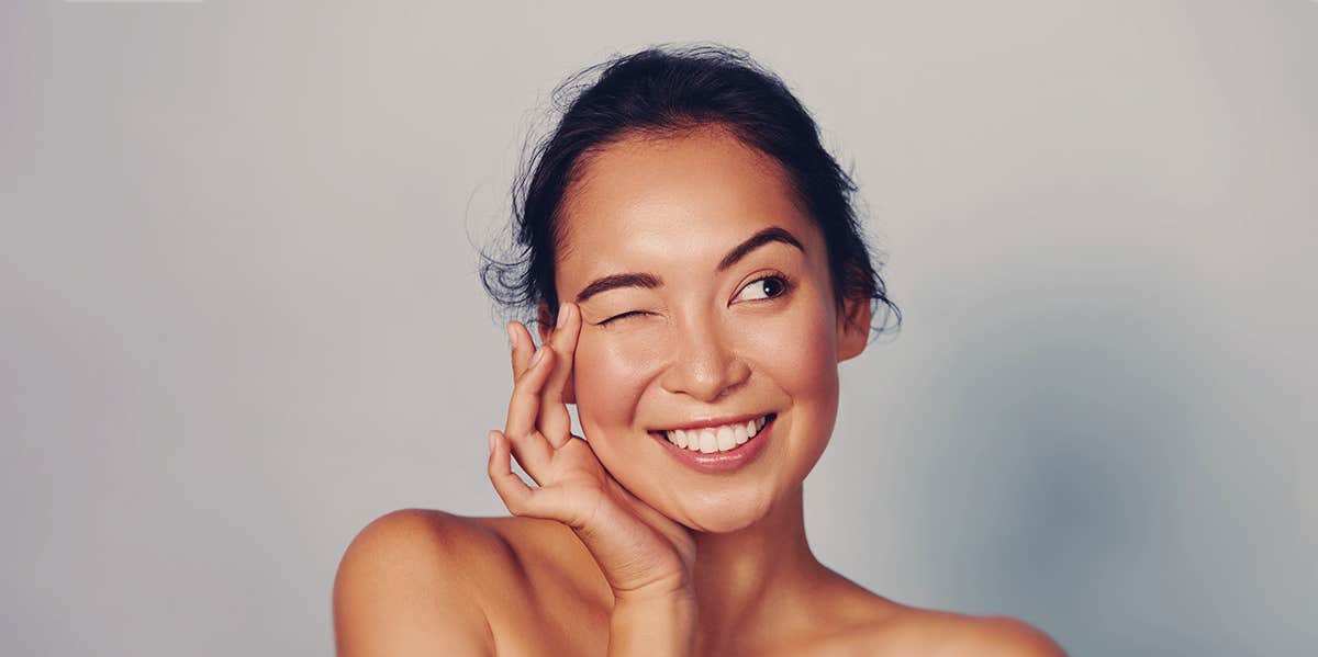 The 5-Letter Cheat Sheet That Will Save You From Skin Cancer woman face smiling