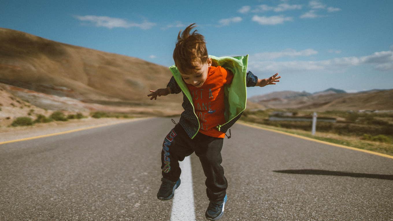 little boy jumping 