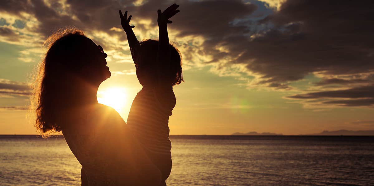 5 Reasons I Think It's Totally Fine To Swear In Front Of My Kids mom holding daughter