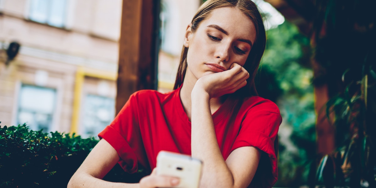 woman looking at phone