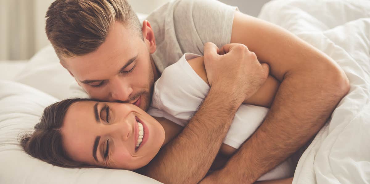 couple cuddling in bed