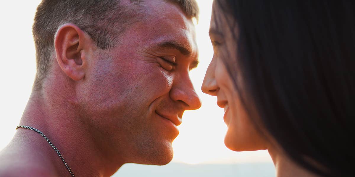 man and woman smiling at each other