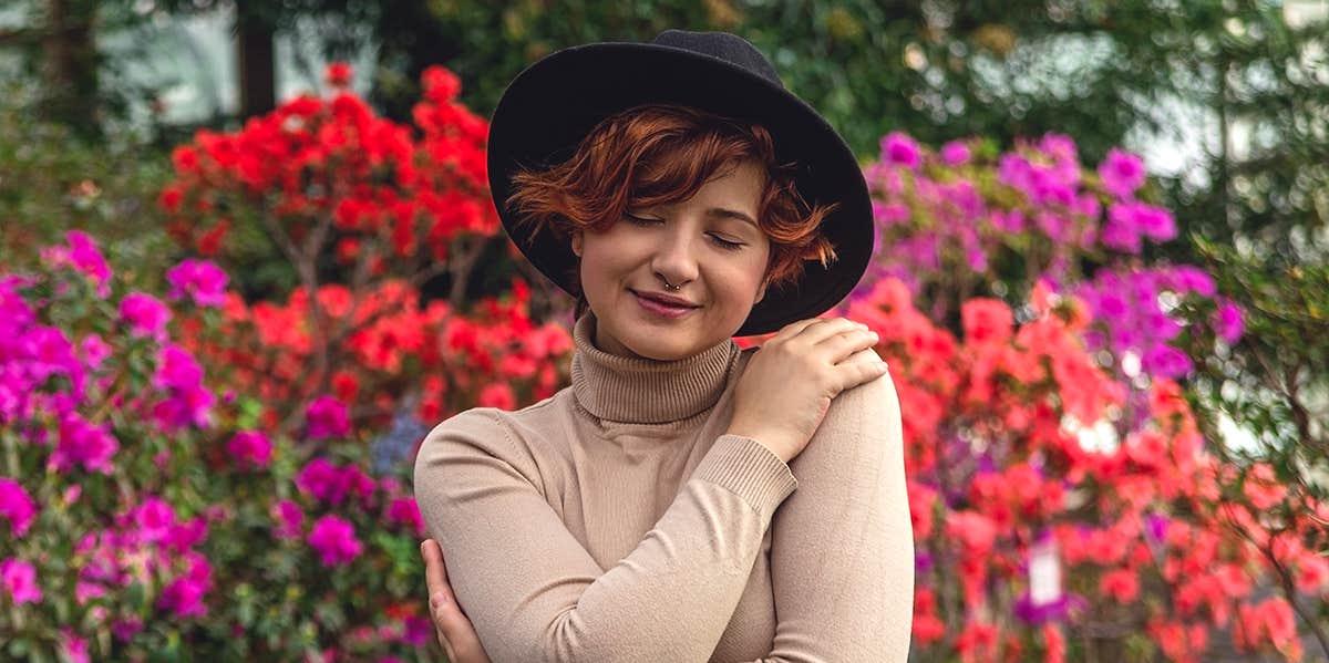 woman hugging herself