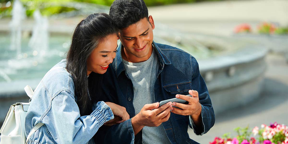 couple using phone together