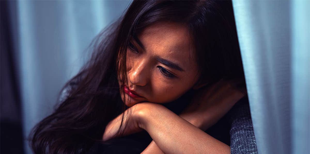 depressed girl sitting alone