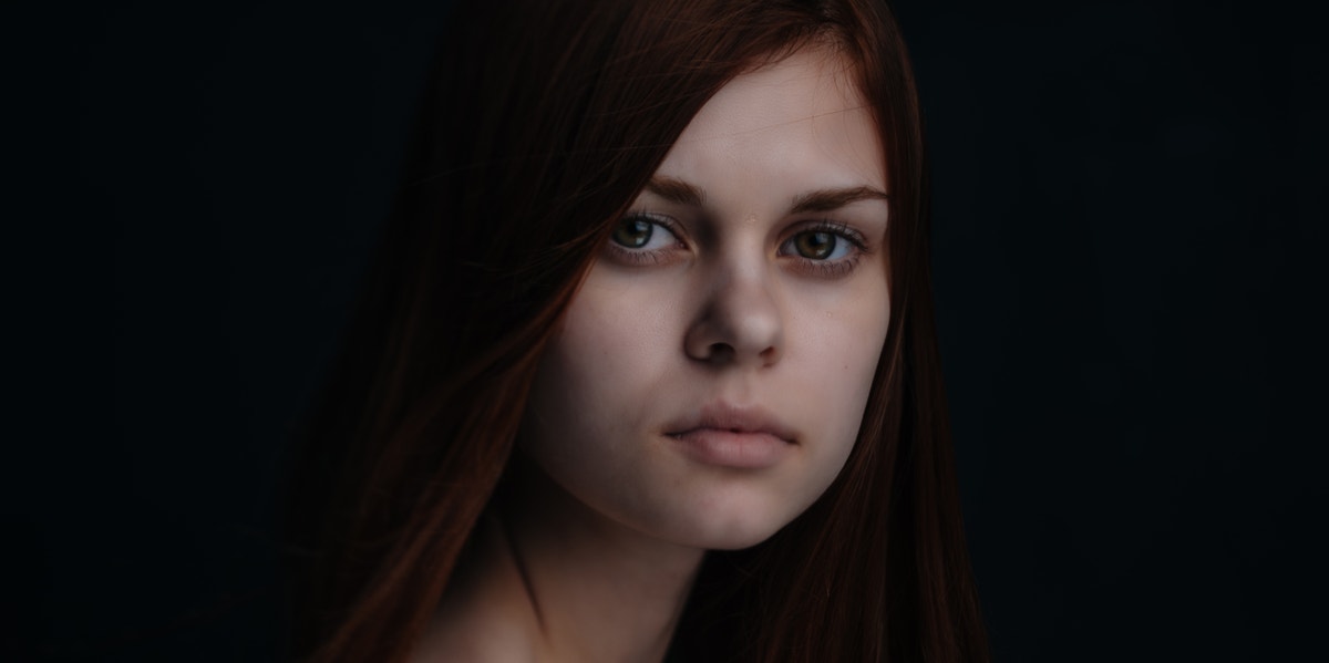5 Different Types Of Lies You Tell Without Even Noticing woman in dark