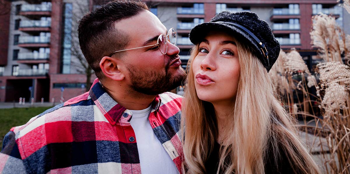 woman making fuck face taking selfie with boyfriend