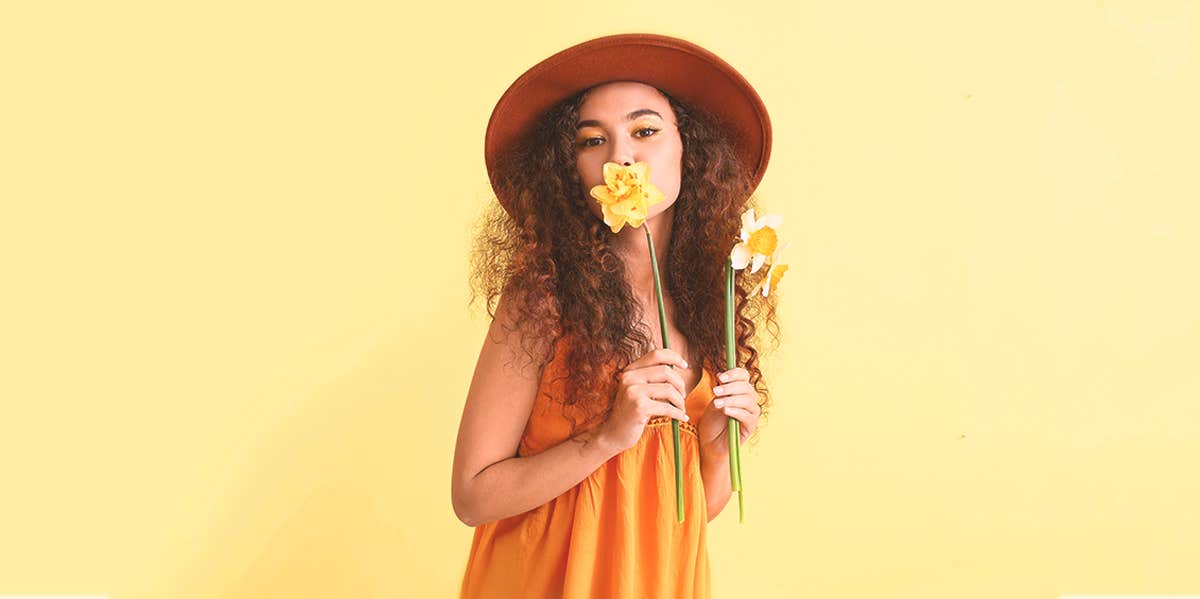 woman holding on a flower