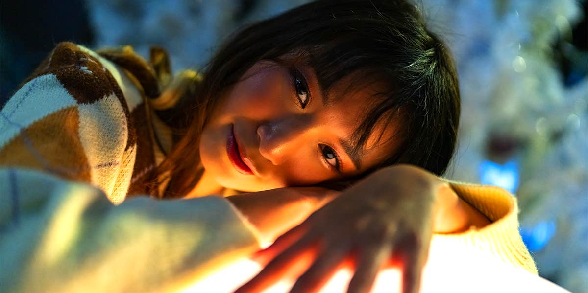 Simple Lessons That Will Make Your Life 1,000X Easier woman smiling laying down