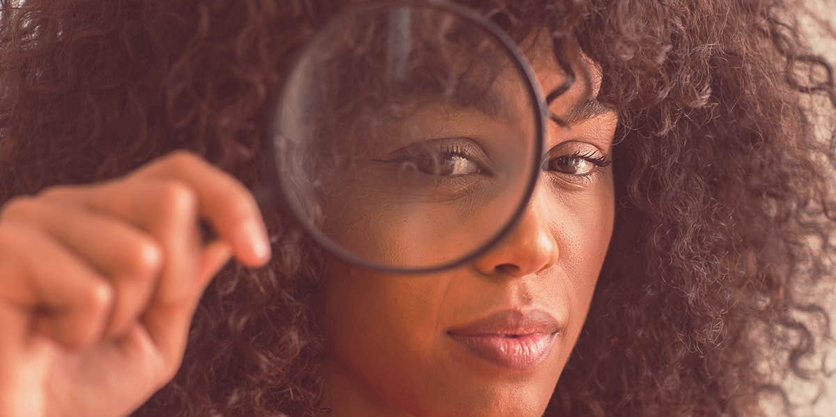 6 Critical Bits Of Love Advice We Always Give (But Never Take) woman holding magnifying glass