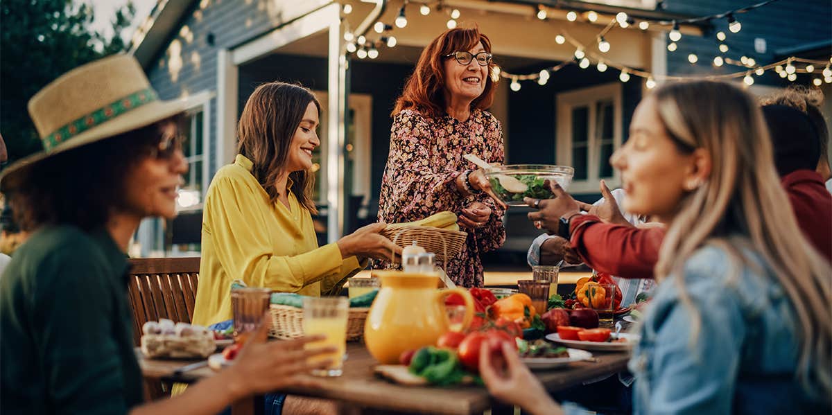 friends having dinner party outside