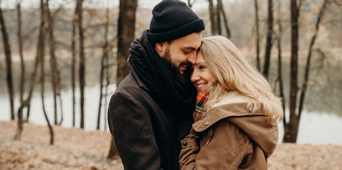 man hugging woman