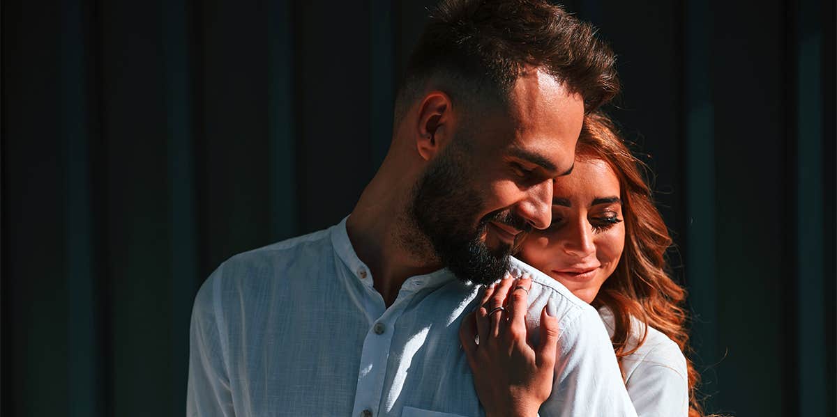 woman hugging man from behind