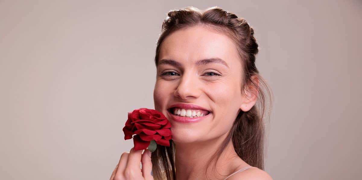 woman holding flower