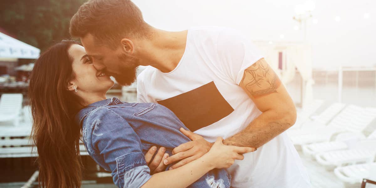 6 Surprising Secrets To A Happy Relationship (That'll Last Decades) man and woman kissing