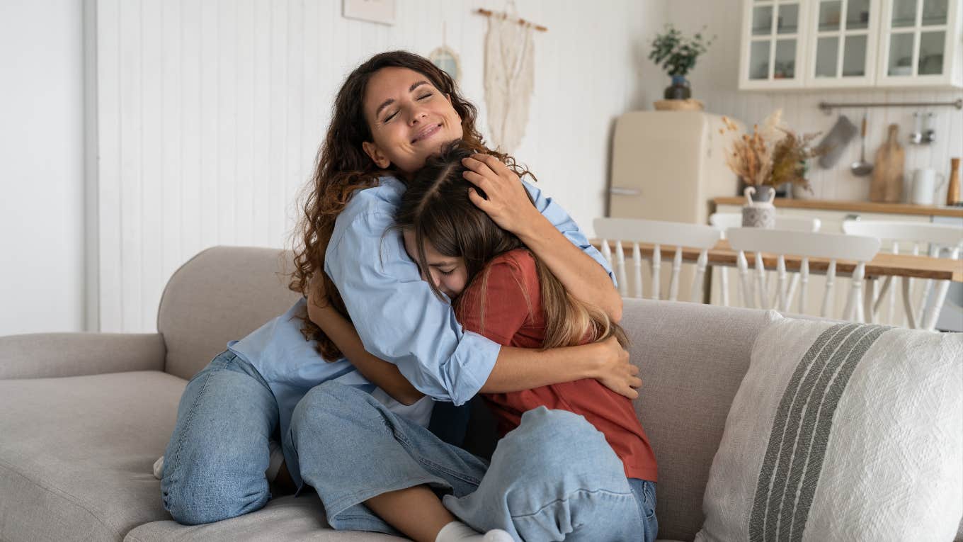 Mom and daughter hugging each other 