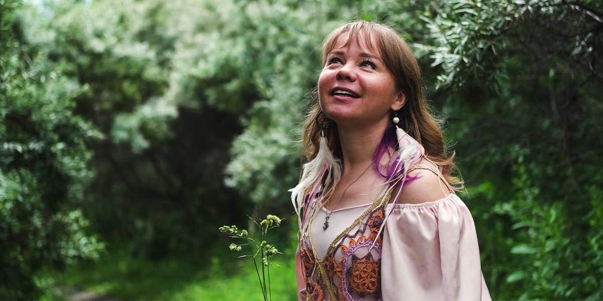 6 Ways Your Relationship with Earth Reveals Your Spiritual Wellness woman outside in nature