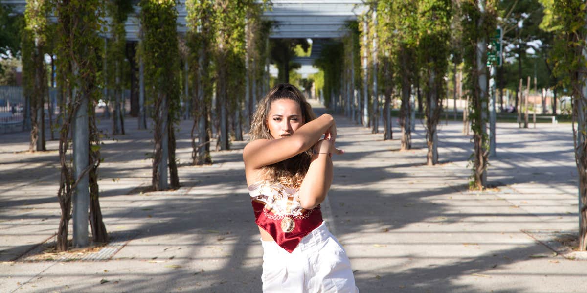 latina woman standing outside