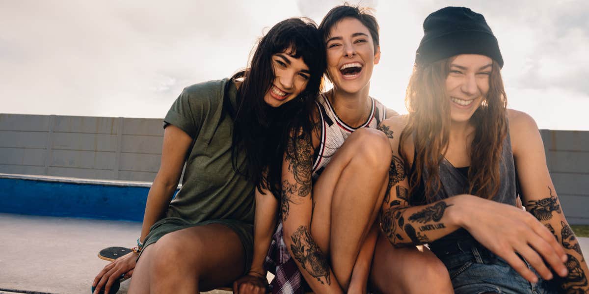 3 women friends laughing
