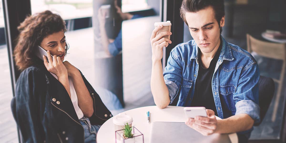 couple playing phones 