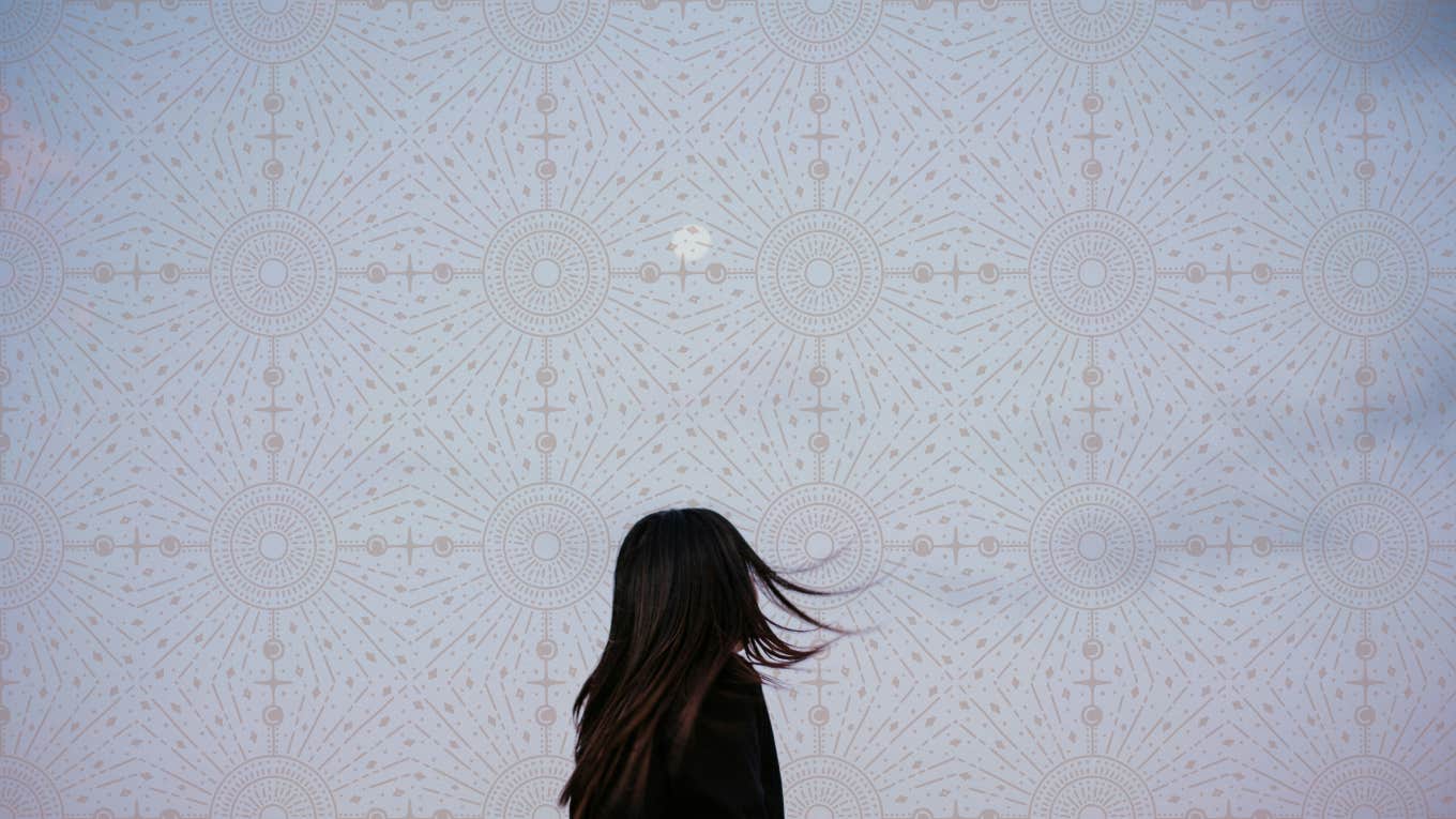 woman looking into the sky