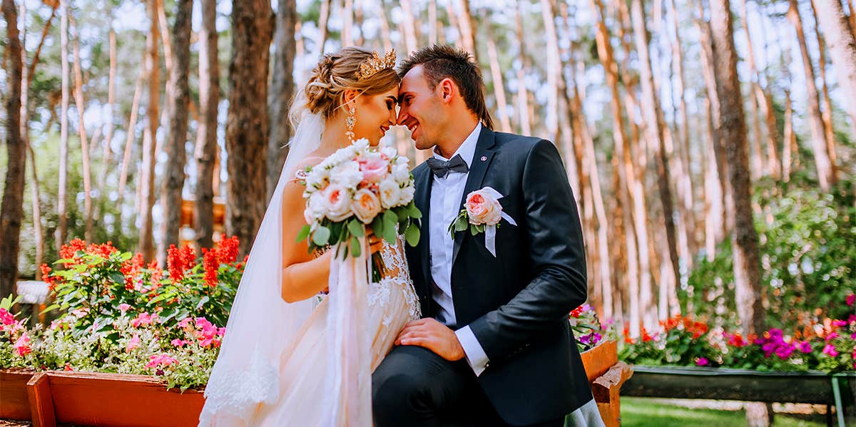 bride and groom sitting in garden