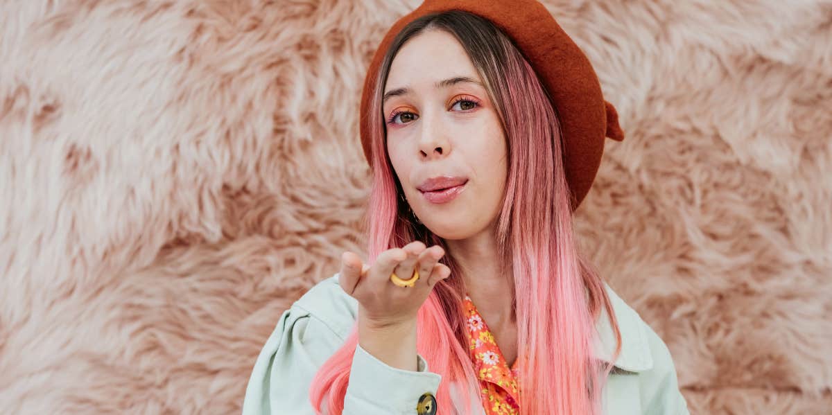 Must-Have Traits Guys Don't Know They Need In A Woman soft woman blowing kiss