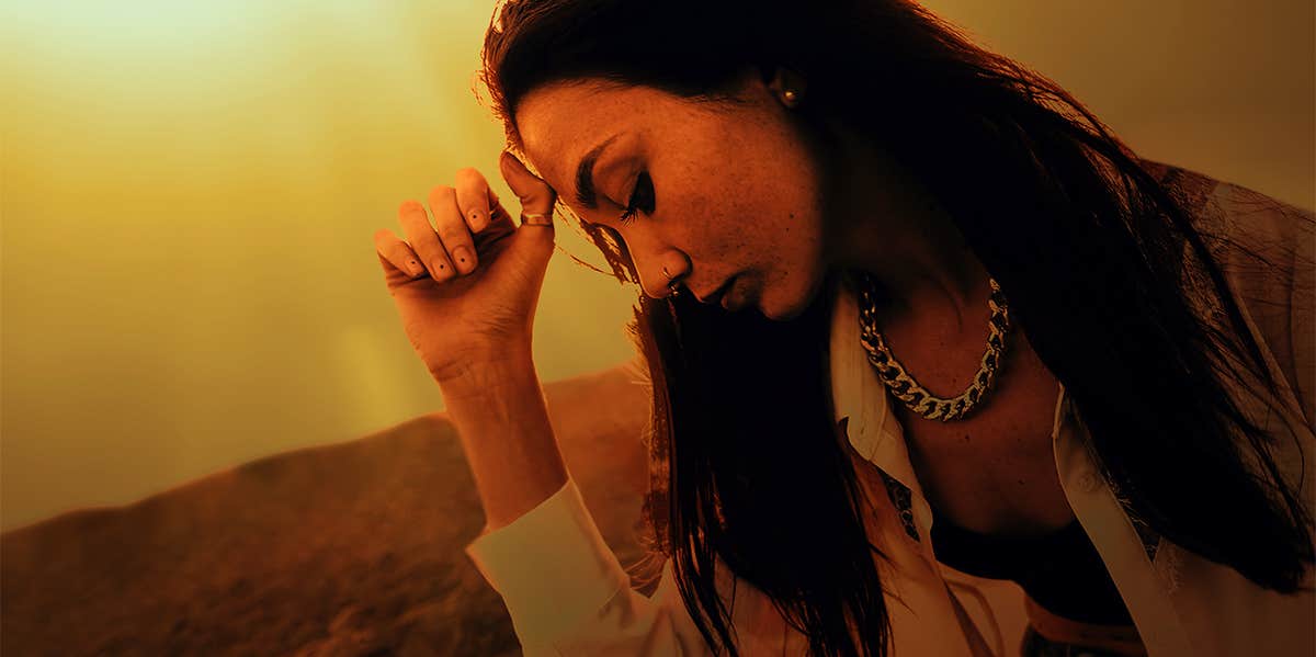 7 Physical Pains That May Be Signs Of Depression depressed woman looking down
