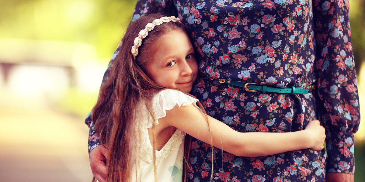 girl hugging grandmother