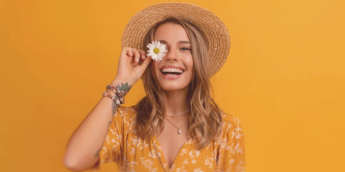 woman in hat smiling