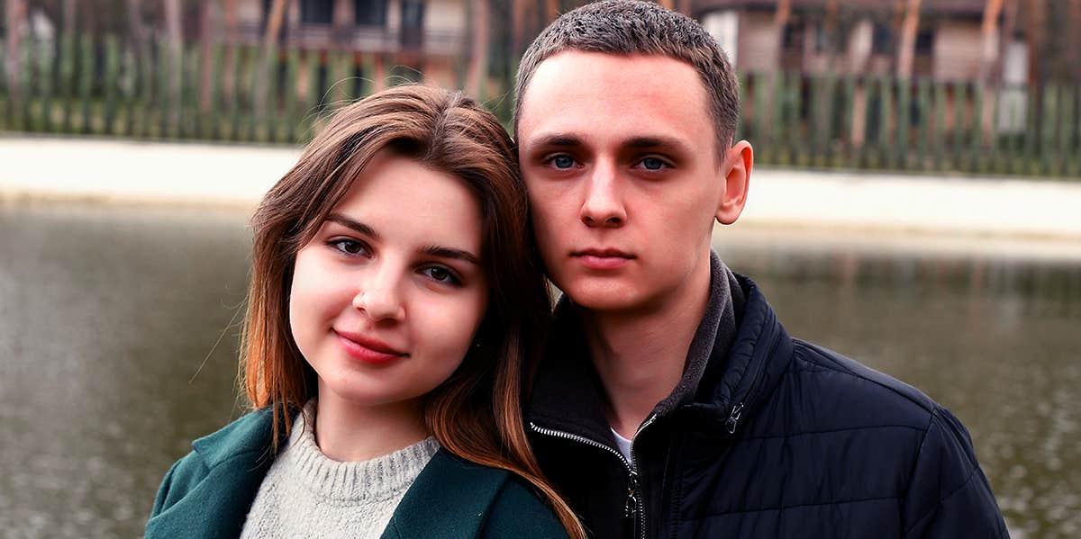 couple posing together for photo