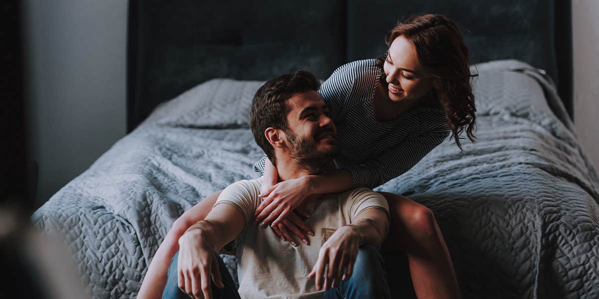 couple sitting on bed