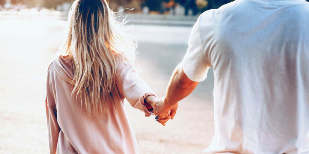 The 8 Real Reasons Your Friends Don't Like Your Boyfriend man and woman holding hands