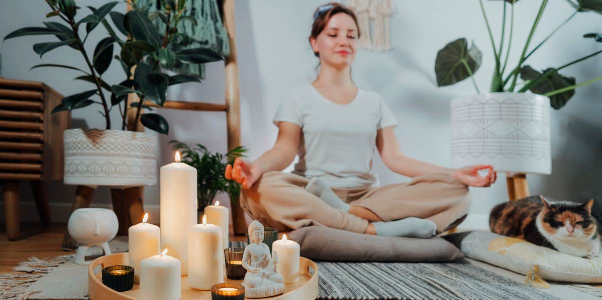 girl meditating in living room